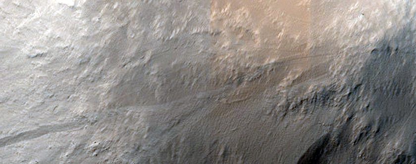 Impact-Related Deposits and Flows around Crater Southwest of Pettit Crater