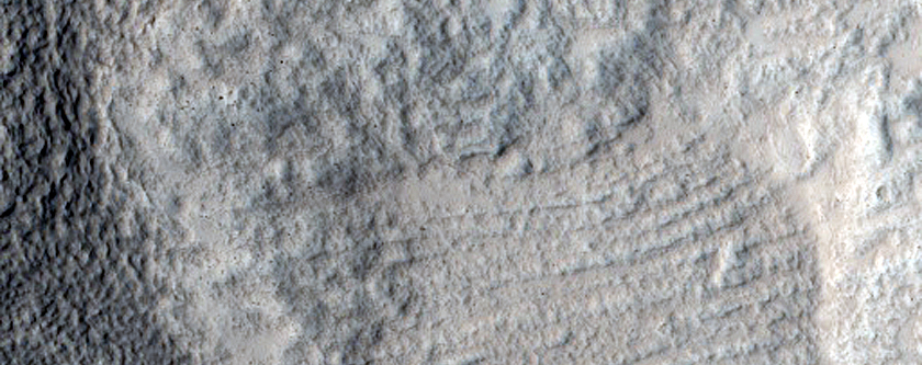 North-Pole-Facing Deposit in Crater Associated with Headwall Erosion