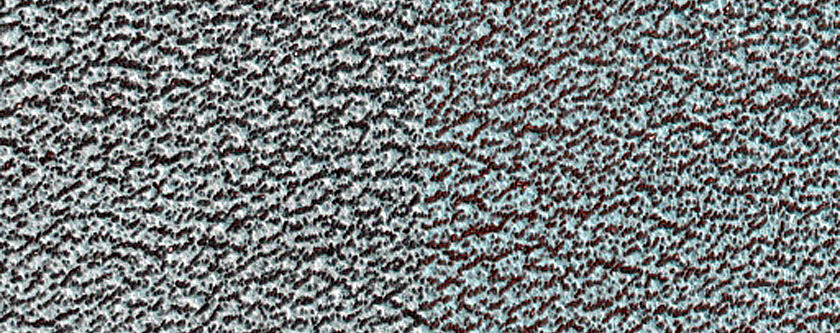 Wind Streak Off of Ice-Filled North Polar Layered Deposits Crater