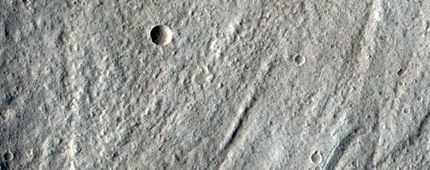 North-Pole-Facing Deposit in Crater Associated with Headwall Erosion