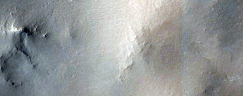 Candidate Recent Impact Site in Maggini Crater