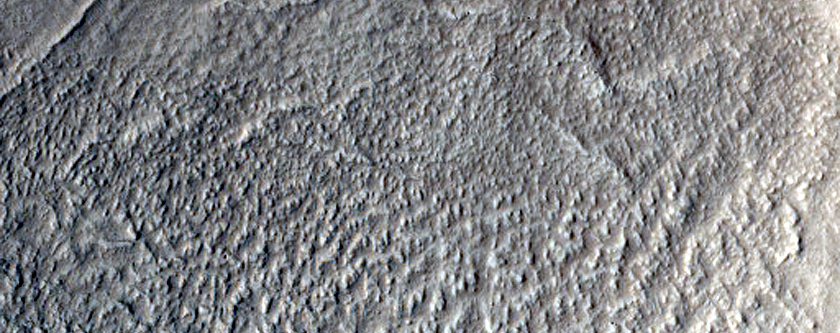 North-Pole-Facing Deposit in Crater Associated with Headwall Erosion