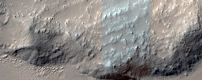 Layers in Crater Wall above Ridged Lava Flow