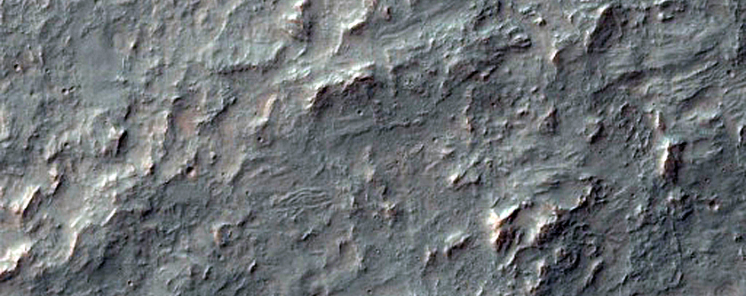 Olivine-Rich Crater Ejecta in Thaumasia Planum