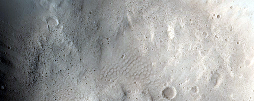 North-Pole-Facing Deposit in Crater Associated with Headwall Erosion