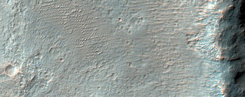 Channel Interacting with Crater in Ladon Valles Basin