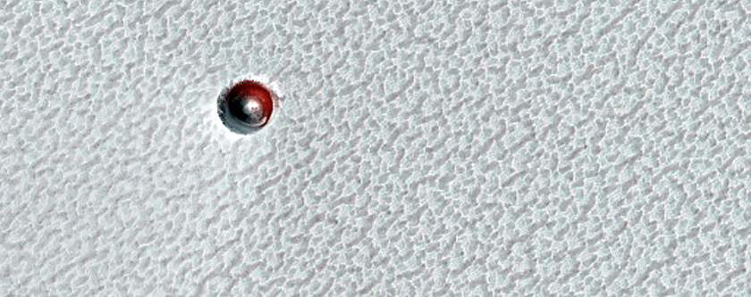 Small Ice-Filled Crater on North Polar Layered Deposits