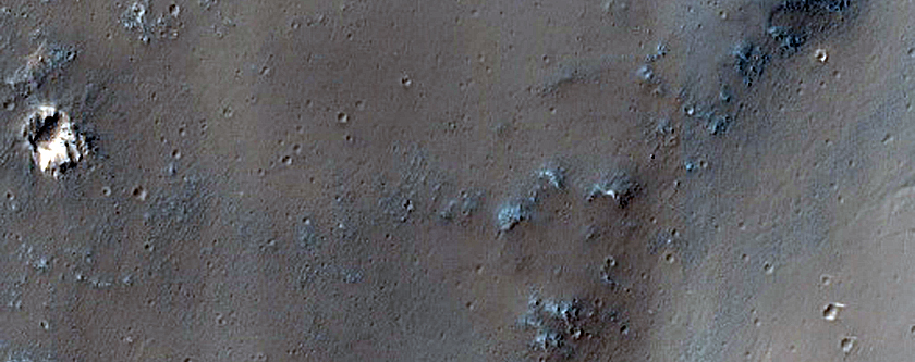 Curved Channel Leading to Trough in Syria Planum