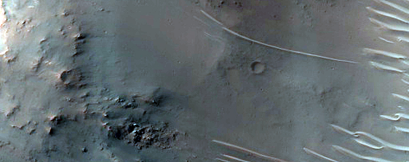 Well-Exposed Wall of 12-Km Crater in Tyrrhena Terra