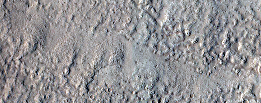 North-Pole-Facing Deposit in Crater Associated with Headwall Erosion