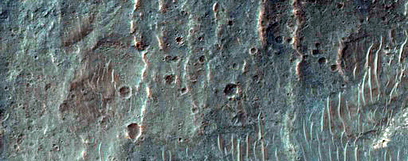 Alluvial Fan and Light-Toned Deposits in Coprates Catena Trough