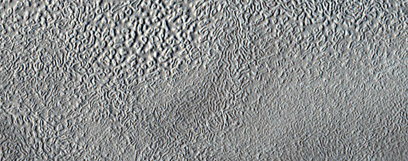 Inverted Valley and Rings near Erebus Montes