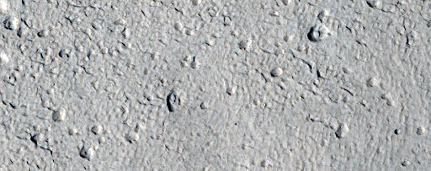 North-Pole-Facing Deposit in Crater Associated with Headwall Erosion