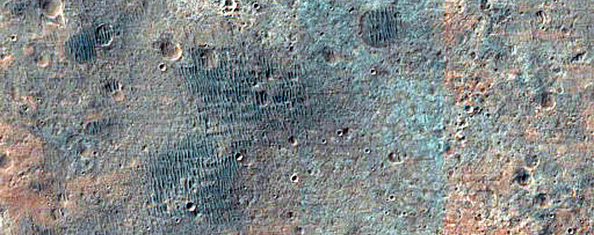 Bright Material in Crater Rim South of Eos Chasma