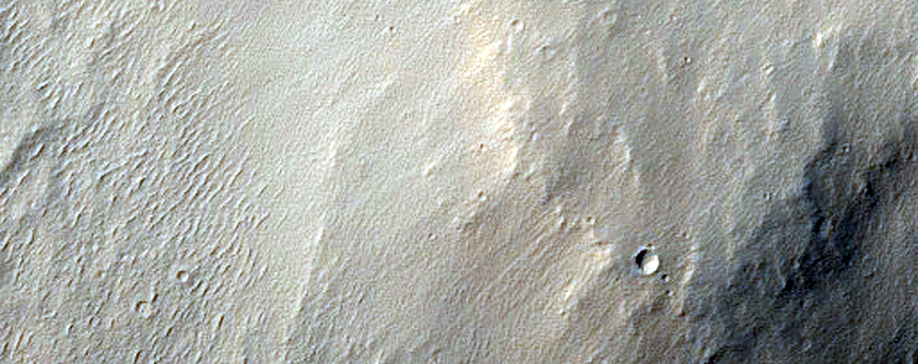 Impact-Related Deposits and Flows Southwest of Pettit Crater