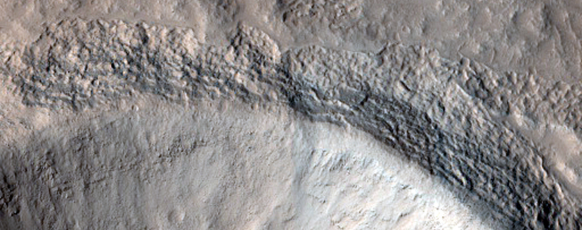 North-Pole-Facing Deposit in Crater Associated with Headwall Erosion