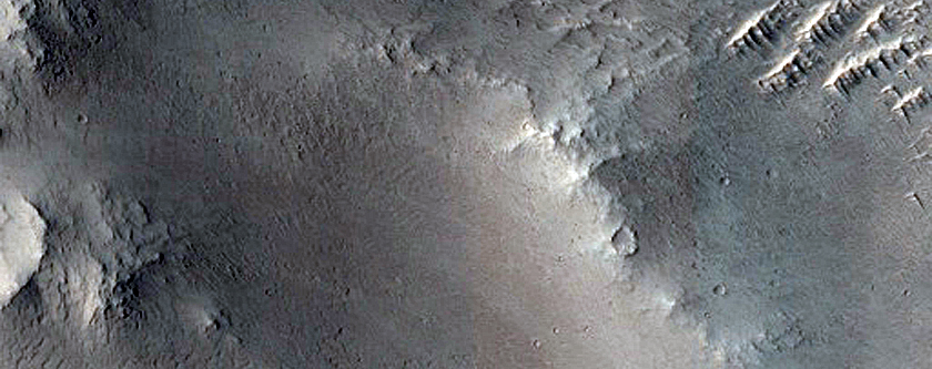 Deposit in Small Northern Mid-Latitude Crater