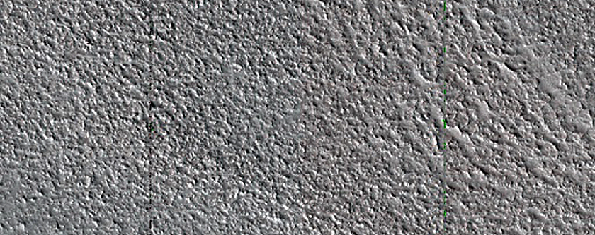 Exposed Layers in Olympia Mensae Icy Outliers