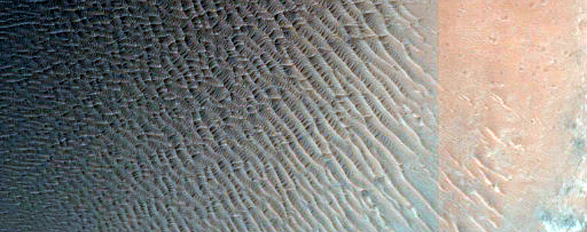 Impact Crater with Light-Toned Deposits on Rim