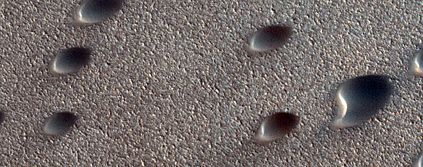 Dune Interaction with Residual Polar Ice West of Olympia Undae