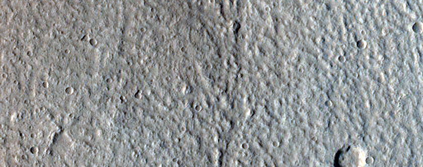 Infilling Deposit with Terminal Ridge in Crater with Headwall Erosion