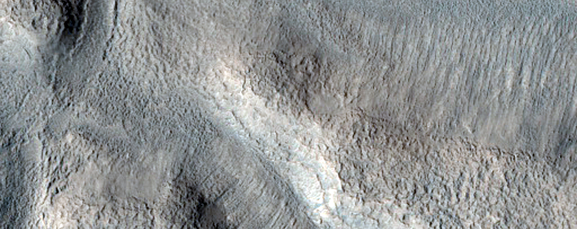 Streamlined Shape and Possible Bar South of Semeykin Crater