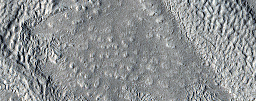 Irregular Terrain near Crater in Arabia Terra