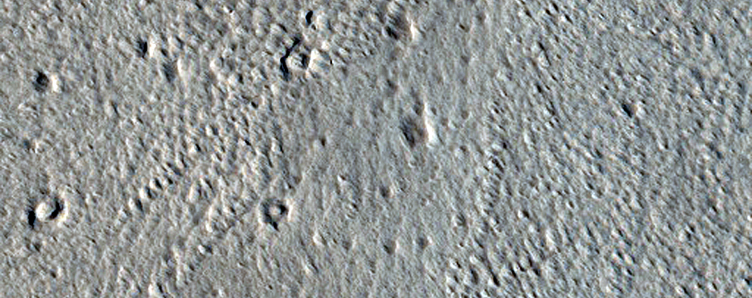North-Pole-Facing Deposit in Crater Associated with Headwall Erosion