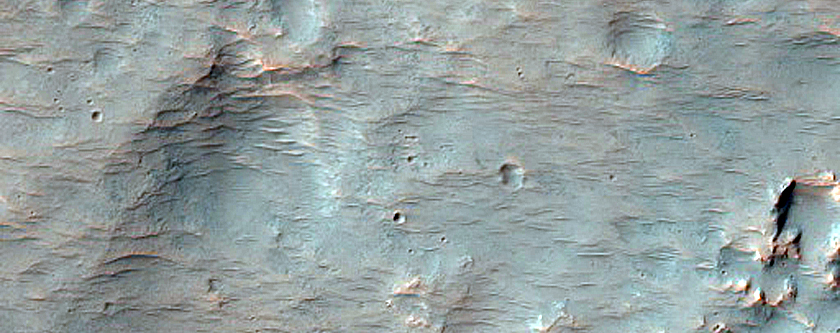 Impact Related Deposits and Flows Northeast of Hellas Planitia