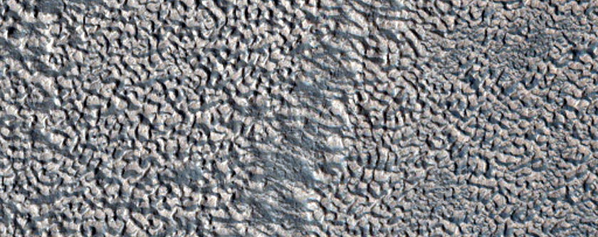 Impact Crater Exposing Structure within Lobate Debris Apron