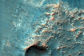 Exposure of Layered Materials along Hellas Planitia Rim Escarpment