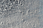 Dipping Layers Related to Deposit Mantle in Hellas Planitia