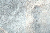 Layered Features in Craters in Promethei Terra