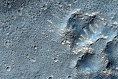 Layered Feature in Crater in Promethei Terra