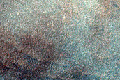 Impact Crater on Side of Trench Northeast of Alba Fossae
