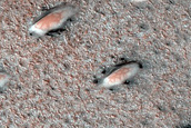 Seasonal Defrosting of West Olympia Region Polar Aeolian-Ice Landforms