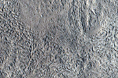 North-Pole-Facing Deposit in Crater Associated with Headwall Erosion