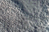 North-Pole-Facing Deposit in Crater Associated with Headwall Erosion