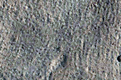 North-Pole-Facing Deposit in Crater Associated with Headwall Erosion
