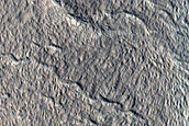 North-Pole-Facing Deposit in Crater Associated with Headwall Erosion