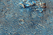 Olivine-Rich Deposits in Crater in Syrtis Major Planum