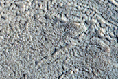 North-Pole-Facing Deposit in Crater Associated with Headwall Erosion