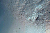 Crater-Related Pitted Materials in 4-Kilometer Crater near Hellas Planitia