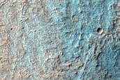 Hydrated Materials in West Hellas Planitia