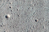 North-Pole Facing Deposit in Crater Associated with Headwall Erosion