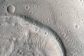 North-Pole-Facing Deposit in Crater Associated with Headwall Erosion