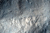 Crater Rim Clipped by Linear Feature