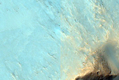 Possible Phyllosilicates Exposed by Terra Cimmeria Impact Crater