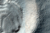 Layered Feature in Crater in Promethei Terra