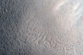 North-Pole-Facing Deposit in Crater Associated with Headwall Erosion